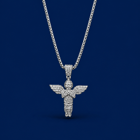 Silver angel pendant necklace on a dark blue background