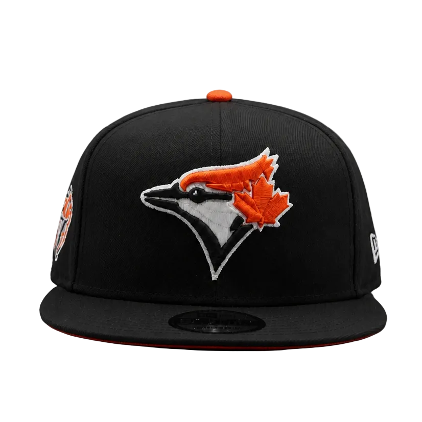 Black baseball cap with a logo on a gray background