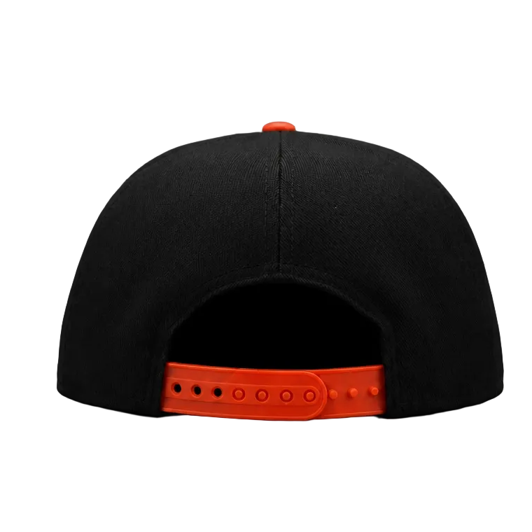 Black cap with orange brim on a gray background