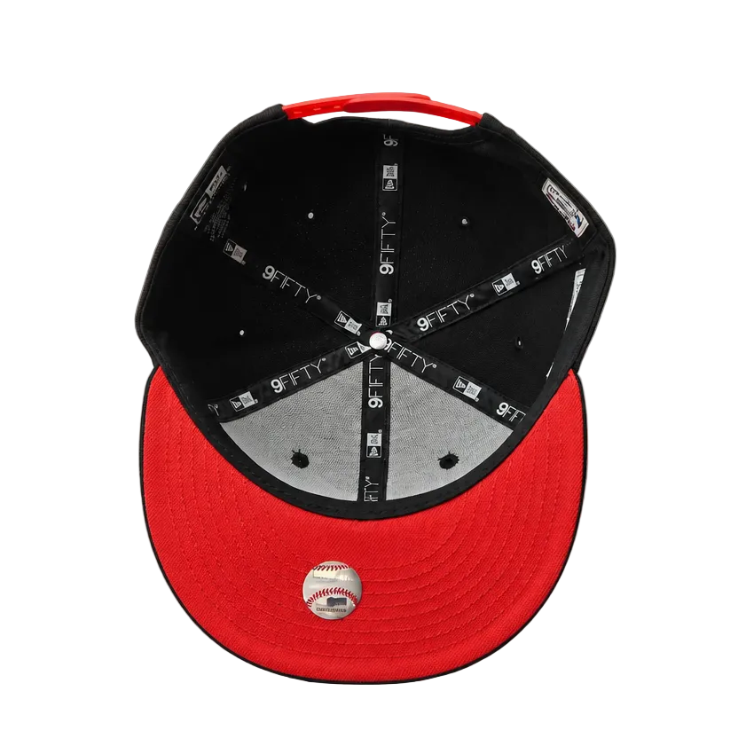 Red and black cap with a gray interior on a gray background