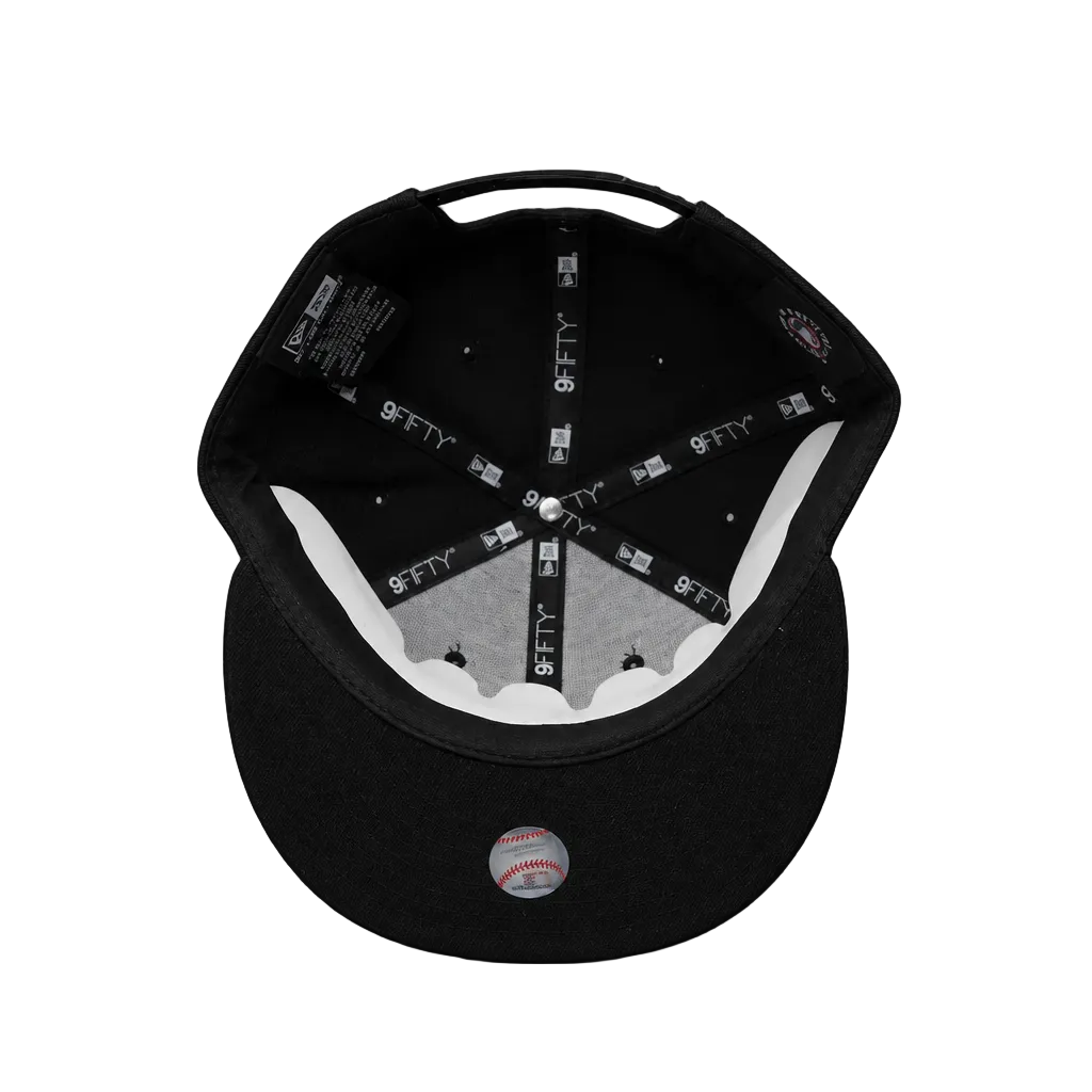Black baseball cap with brand logo on a white background
