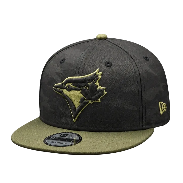 Black and green baseball cap with a logo on a gray background