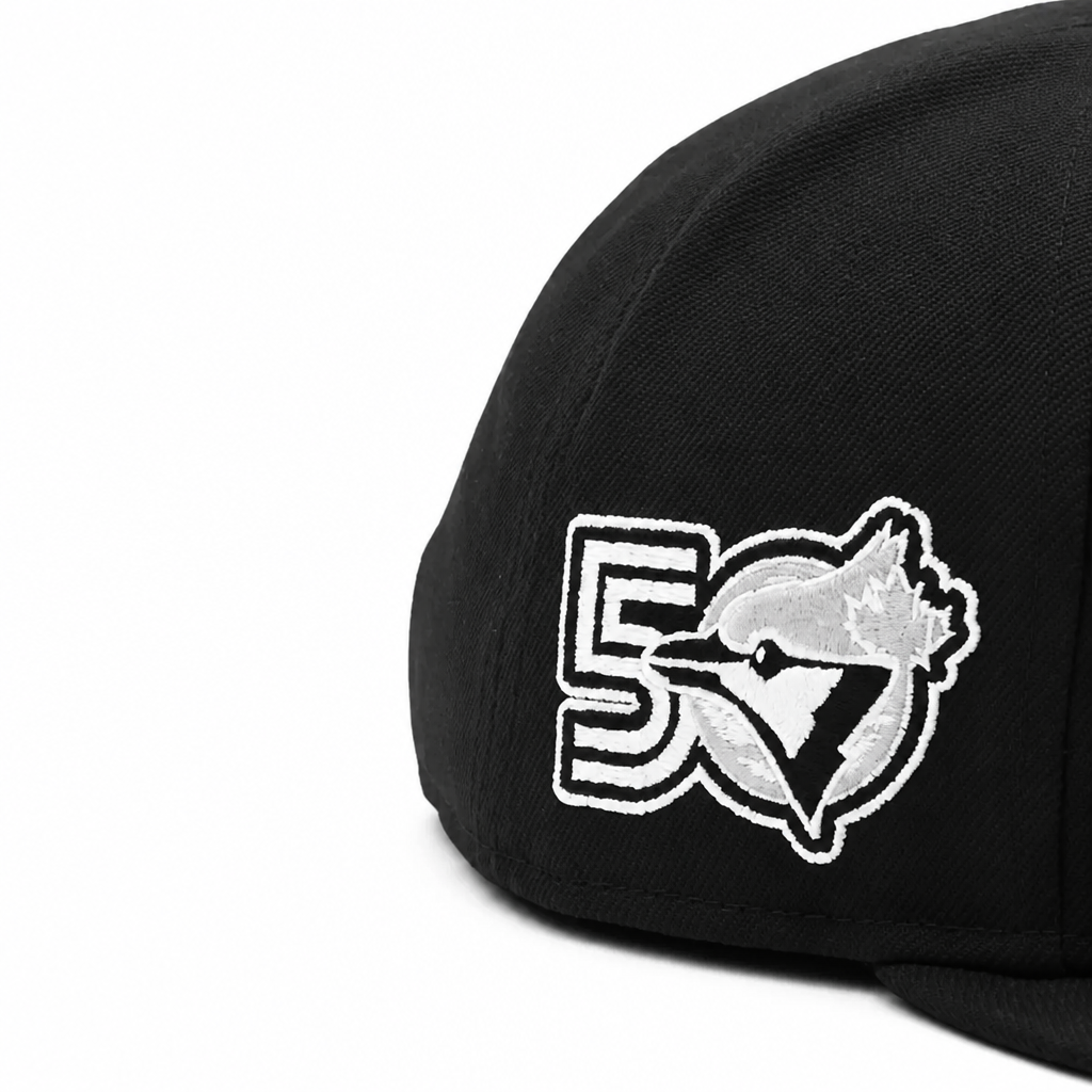 Black cap with a white logo on a white background