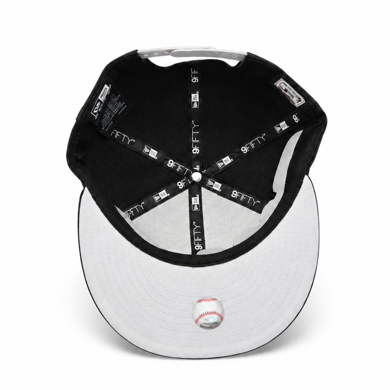 Black and white baseball cap with brand logo on a white background