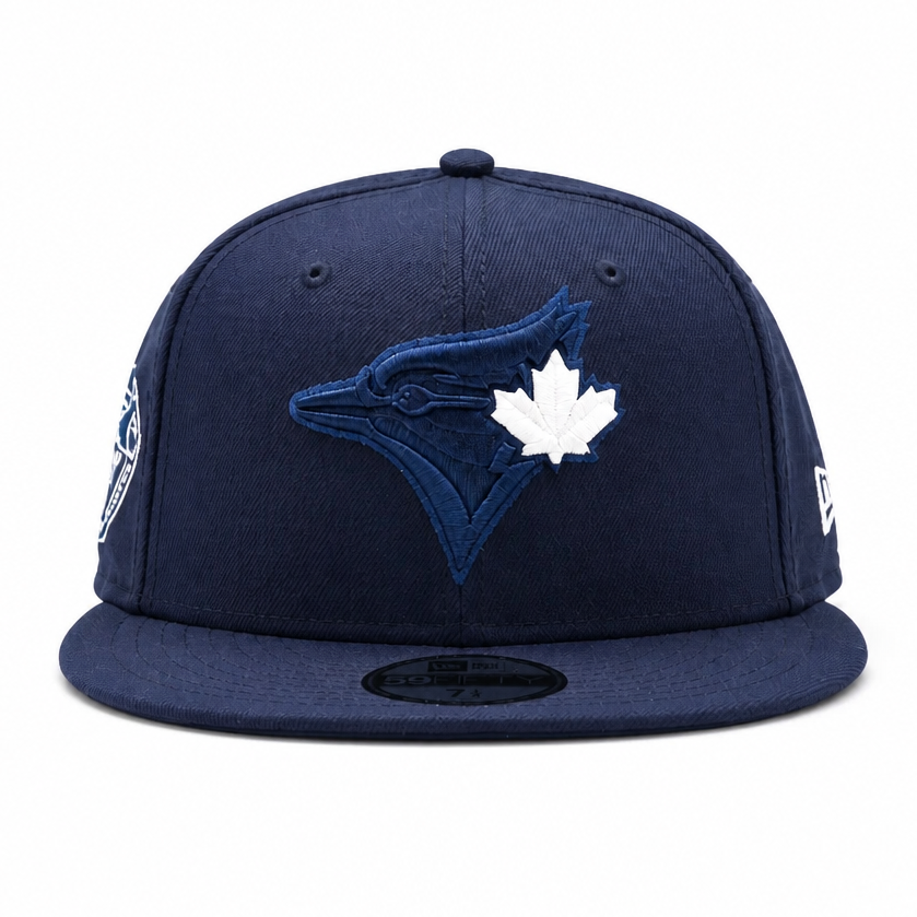 Navy blue baseball cap with a logo on a white background