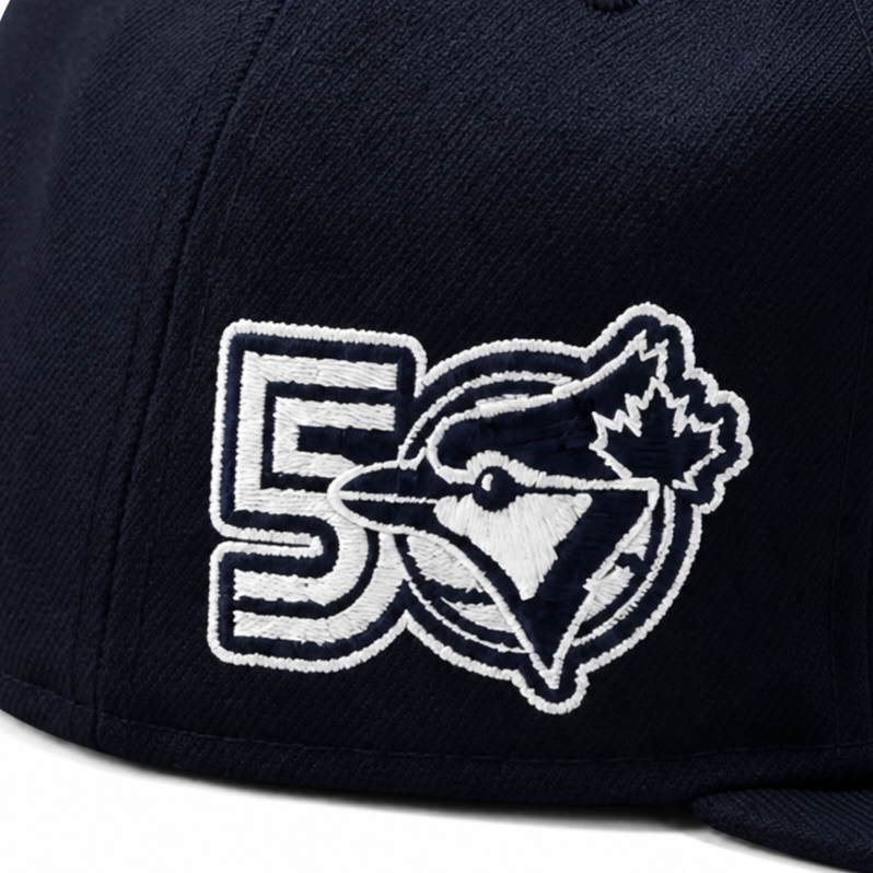 Navy blue cap with a logo featuring a maple leaf and number 5 on a white background