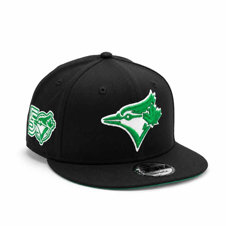 Black baseball cap with green and white logo on a white background