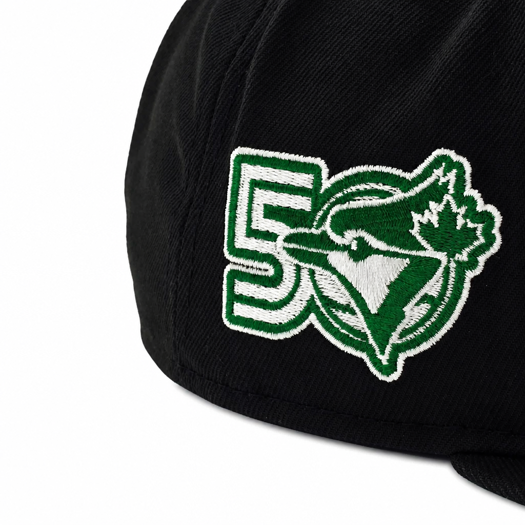 Black cap with a green and white logo on a white background