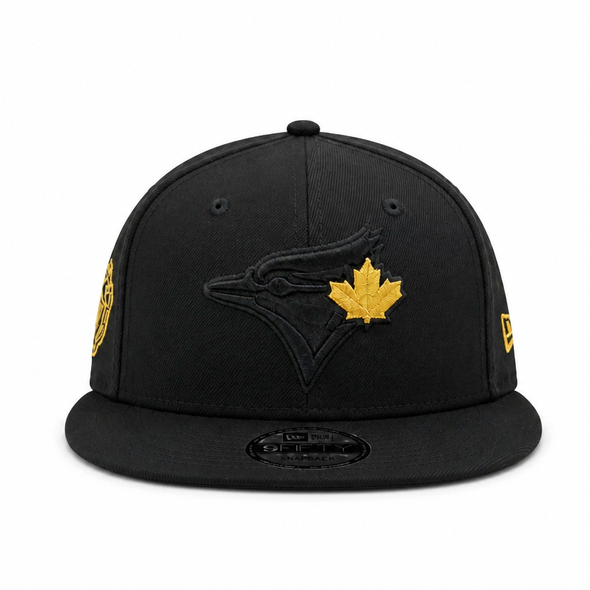 Black baseball cap with gold maple leaf and logo on a white background