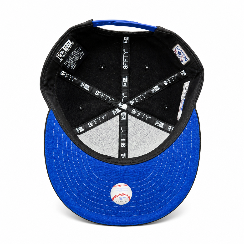 Blue and black baseball cap with brand logo on a white background