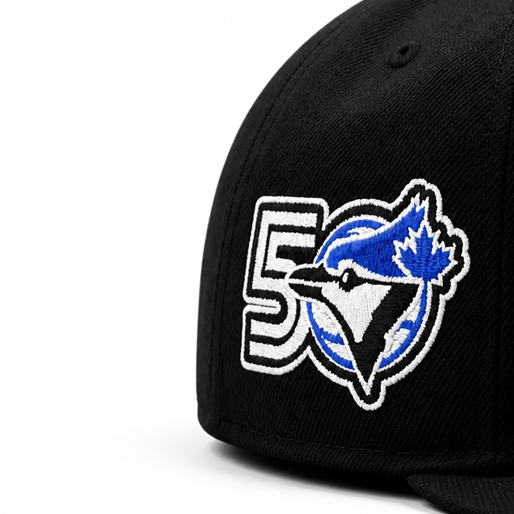 Black cap with a blue and white logo featuring a maple leaf and number 5 on a white background