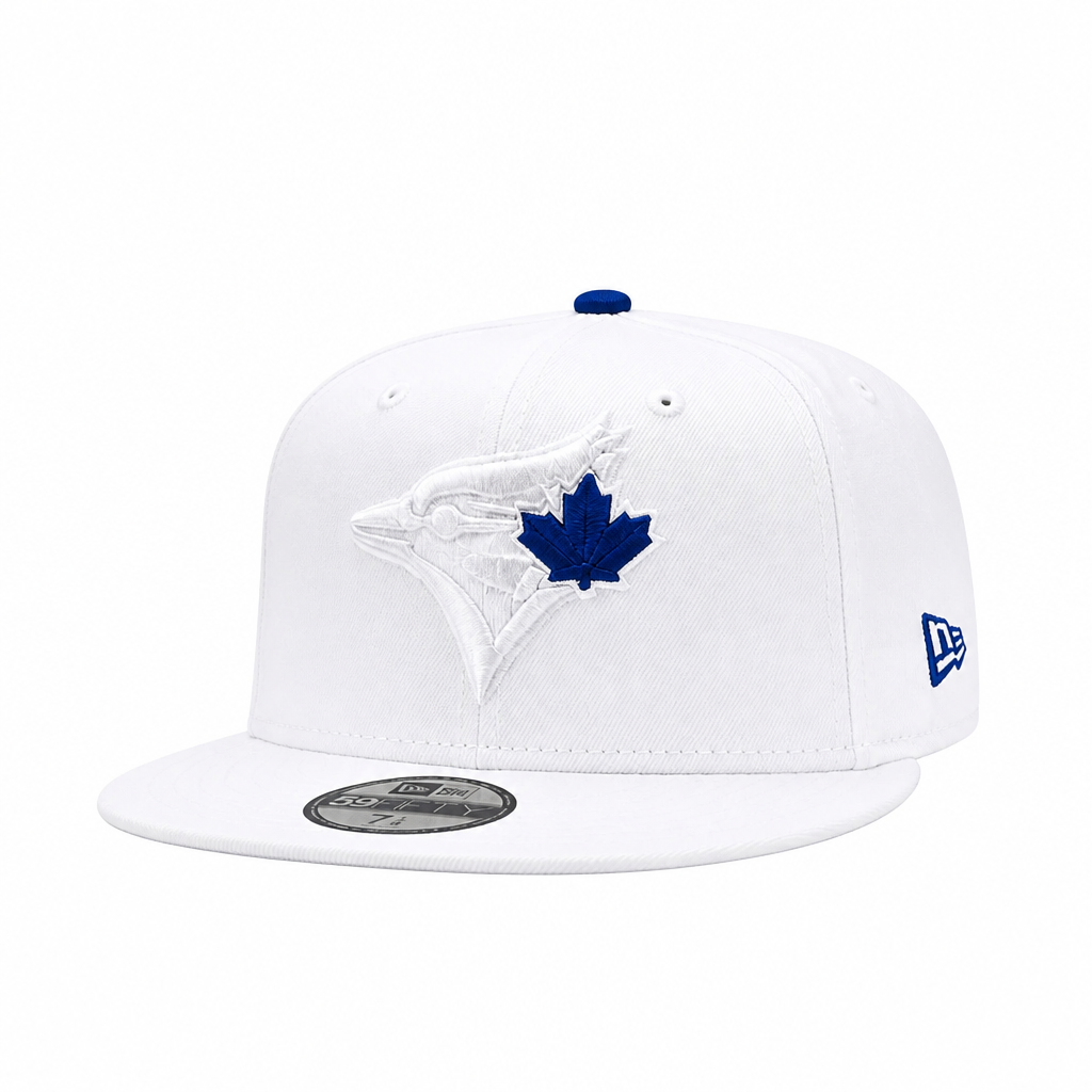 A white Toronto Blue Jays 9FIFTY fitted cap by New Era, featuring a white embroidered bird logo with a blue maple leaf on the front, a blue button on top, and a blue New Era logo on the side.