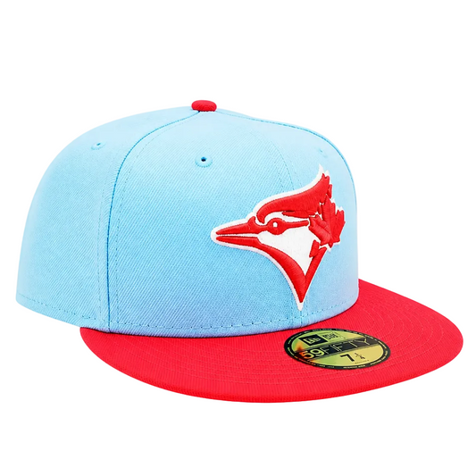 A light blue and red Toronto Blue Jays fitted baseball cap by New Era, featuring the team's bird logo embroidered on the front.