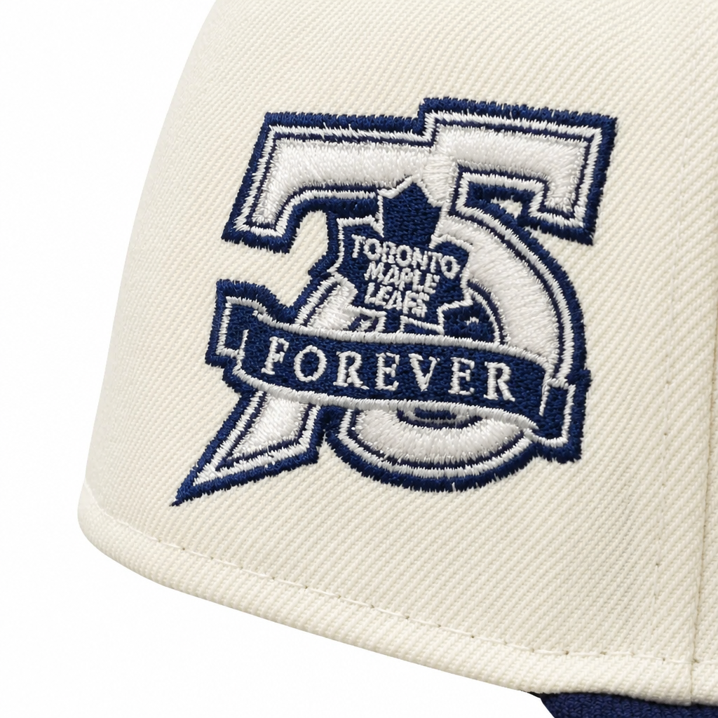 NEW ERA 9FIFTY NHL 75 FOREVER TORONTO MAPLE LEAFS CREAM/NAVY SNAPBACK HAT