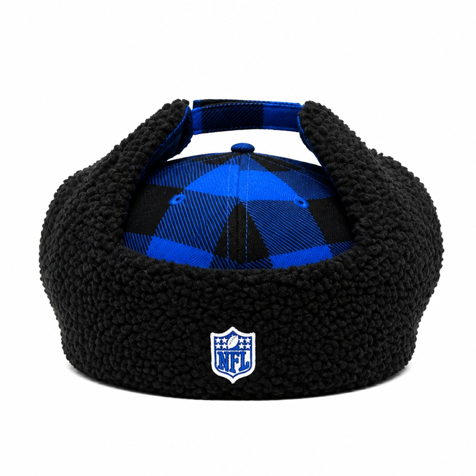 A black fleece winter cap with ear flaps, featuring a blue and black plaid pattern on the crown and a white NFL shield logo on the front.