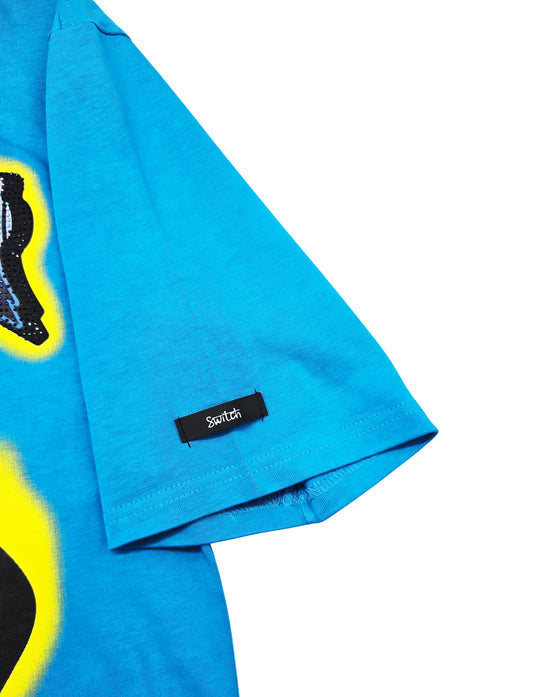 SWITCH MEN'S RHINESTONE MAMMON MATERIALISM MONSTER DROP SHOULDER GRAPHIC T-SHIRT (AQUA BLUE)
