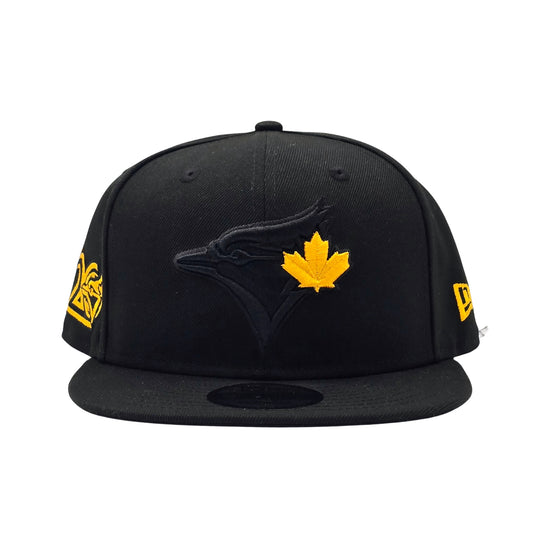 NEW ERA 9FIFTY MLB TORONTO BLUE JAYS 20TH ANNIVERSARY ALL BLACK & GOLD LEAF SNAPBACK HAT