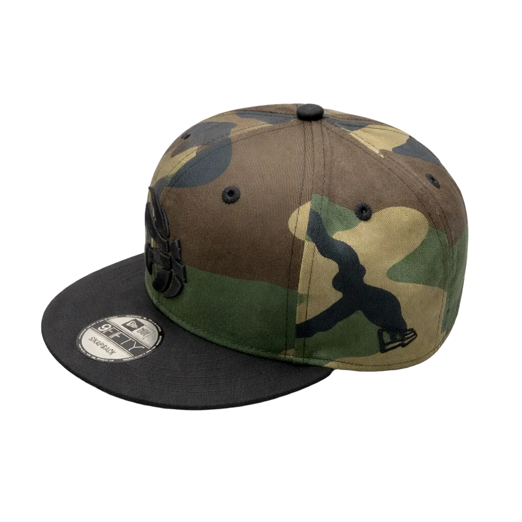 MEN'S TORONTO RAPTORS 950 CAMO WITH BLACK LOGO SNAPBACK HAT